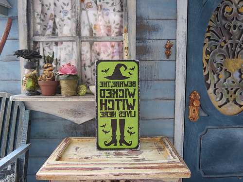 wood green and yellow wooden wall decor witch